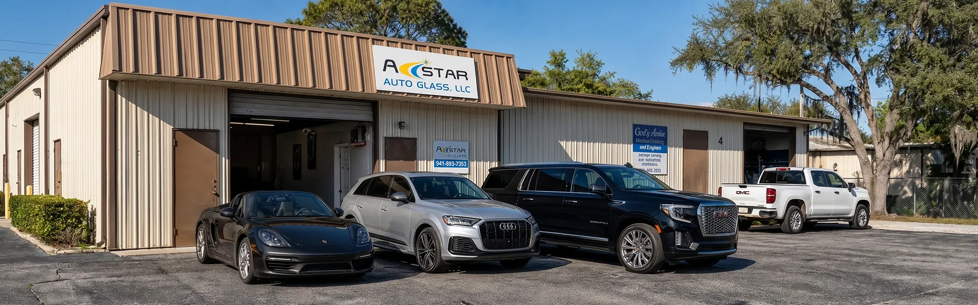 A Star Auto Glass shop exterior at 4023 Sawyer Rd in Sarasota with customer vehicles parked in front
